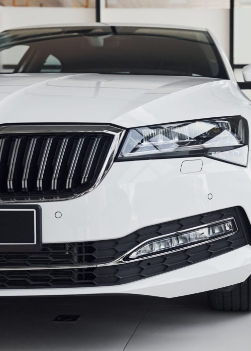 modern-white-car-in-dealership-showroom-1x1